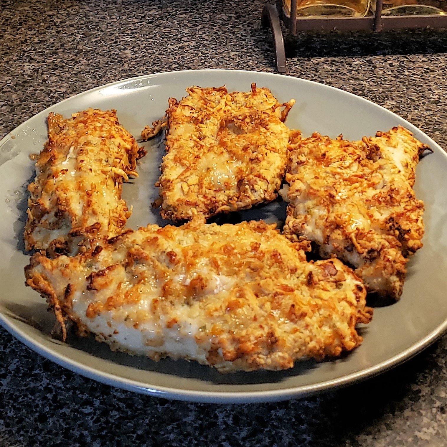 Crispy chicken breasts on plate