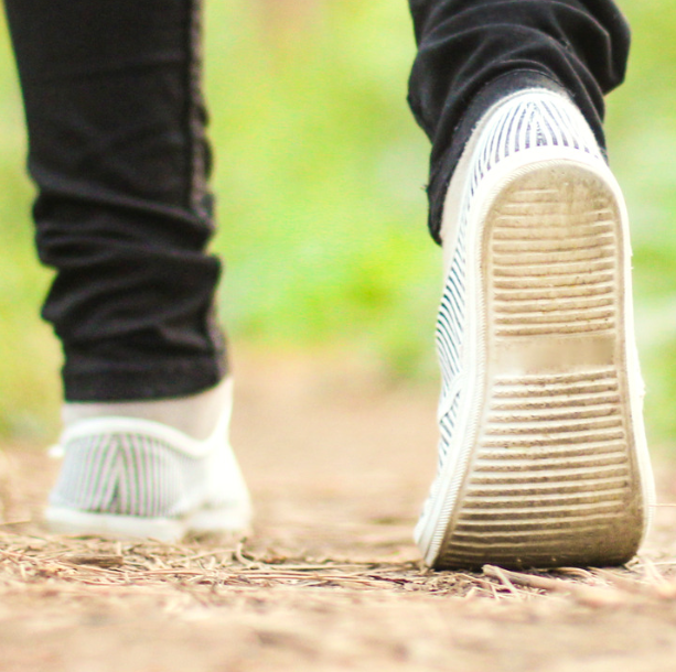 Shoes walking on grass